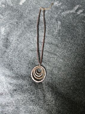 Layered Circle Pendant Necklace in Bronze on Brown Cord